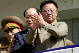 FILE - In this April 25, 2002 file photo, North Korean leader Kim Jong Il, right, applauds with Kim Yong Nam, president of the People's Congress from the balcony of a building during a military parade, celebrating the 70th anniversary of the founding of North  Korean People's Army in Pyongyang, North Korea. North Korean television announced Monday, Dec. 19, 2011 in a "special broadcast" that its leader Kim Jong Il has died in Pyongyang. (AP Photo/Katsumi Kasahara, File)