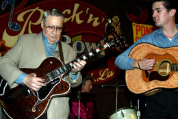 Scotty Moore, left, a former guitarist for Elvis Presley, D.J. Fontana, center, on drums, and Eddie Clendening ll play music at the 2nd annual Ponderosa Stomp, Wednesday night, April 30, 2003 in New Orleans. The Ponderosa Stomp is a fringe festival dedicated to trailblazing but long-forgotten blues, swamp pop, rhythm and blues and rockabilly musicians. (AP Photo/Judi Bottoni)