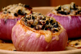 ** FOR USE WITH AP WEEKLY FEATURES **    Red Onion Chili is baked in hollowed-out onions. The sweetness of the onion complements the bold flavor of the vegetarian chili topped with cheese. (AP Photo/Larry Crowe)