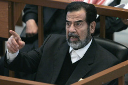**FILE**  Former Iraqi President Saddam Hussein reacts in court while listening to the prosecution, during the Anfal genocide trial in Baghdad, Iraq, in this Dec. 21, 2006 file photo.  Some Arab media are reporting, Saturday morning, Dec. 30, 2006, that Saddam Hussein has been executed. The Associated Press is seeking confirmation. (AP Photo / Nikola Solic, pool, file)