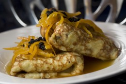 This photo taken Nov. 15, 2009 shows blintzes. The tradition of eating dairy at Hanukkah finds a good place with these lemon and dried blueberry blintzes. They have a creamy ricotta cheese filling inside, providing a tasty way to serve dairy for Hanukkah. (AP Photo/Larry Crowe)
