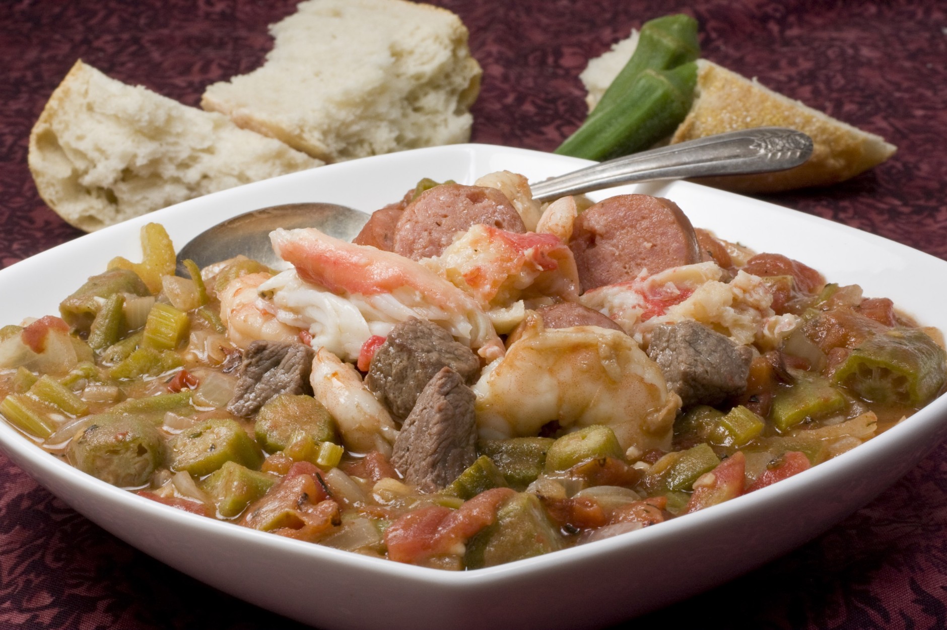This photo taken Feb. 7, 2010 shows gumbo. Packed with meat and seafood this fast and intense gumbo is a culinary trip to New Orleans. Okra, a must have ingredient, plays prominently in this Mardi Gras inspired dish. (AP Photo/Larry Crowe)