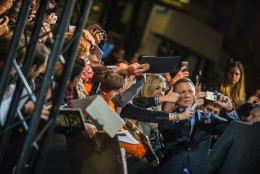 Daniel Craig poses a selfie with fans as he arrives for the French premiere of the James Bond movie 'Spectre' in Paris, Thursday, Oct. 29, 2015. (AP Photo/Kamil Zihnioglu)