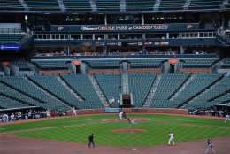 FOR USE AS DESIRED, YEAR END PHOTOS - FILE - The Baltimore Orioles bat against the Chicago White Sox during a baseball game without fans Wednesday, April 29, 2015, in Baltimore. Due to security concerns in the wake of riots following the funeral for Freddie Gray, the game was closed to the public. Gray suffered a spinal injury in police custody and later died. (AP Photo/Gail Burton, File)