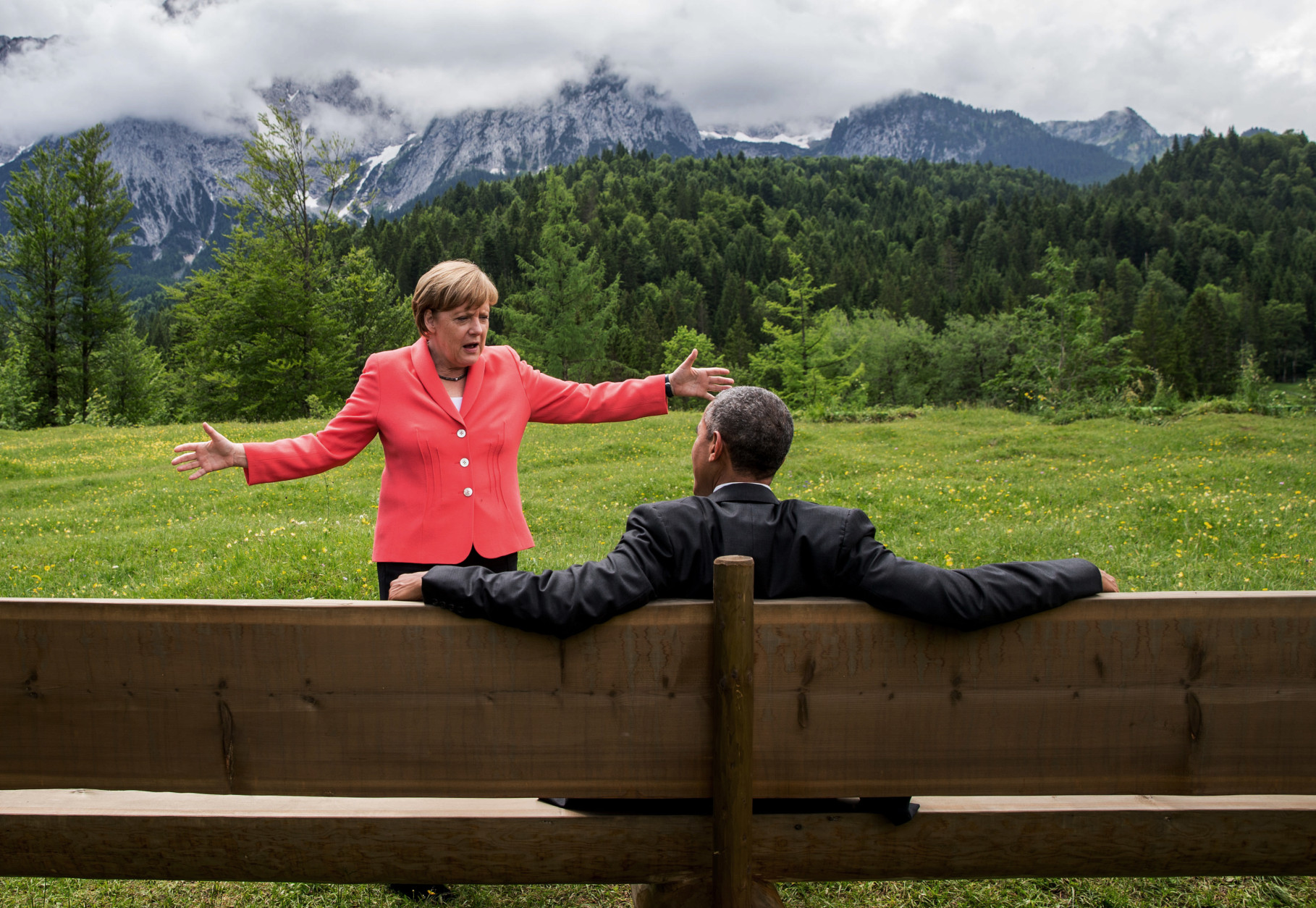 FOR USE AS DESIRED, YEAR END PHOTOS - FILE - German chancellor Angela Merkel  speaks with U.S. president Barack Obama at  Schloss Elmau hotel near Garmisch-Partenkirchen, southern Germany, Monday June 8, 2015 during the G-7 summit.  (Michaek Kappeler/Pool Photo via AP, File)