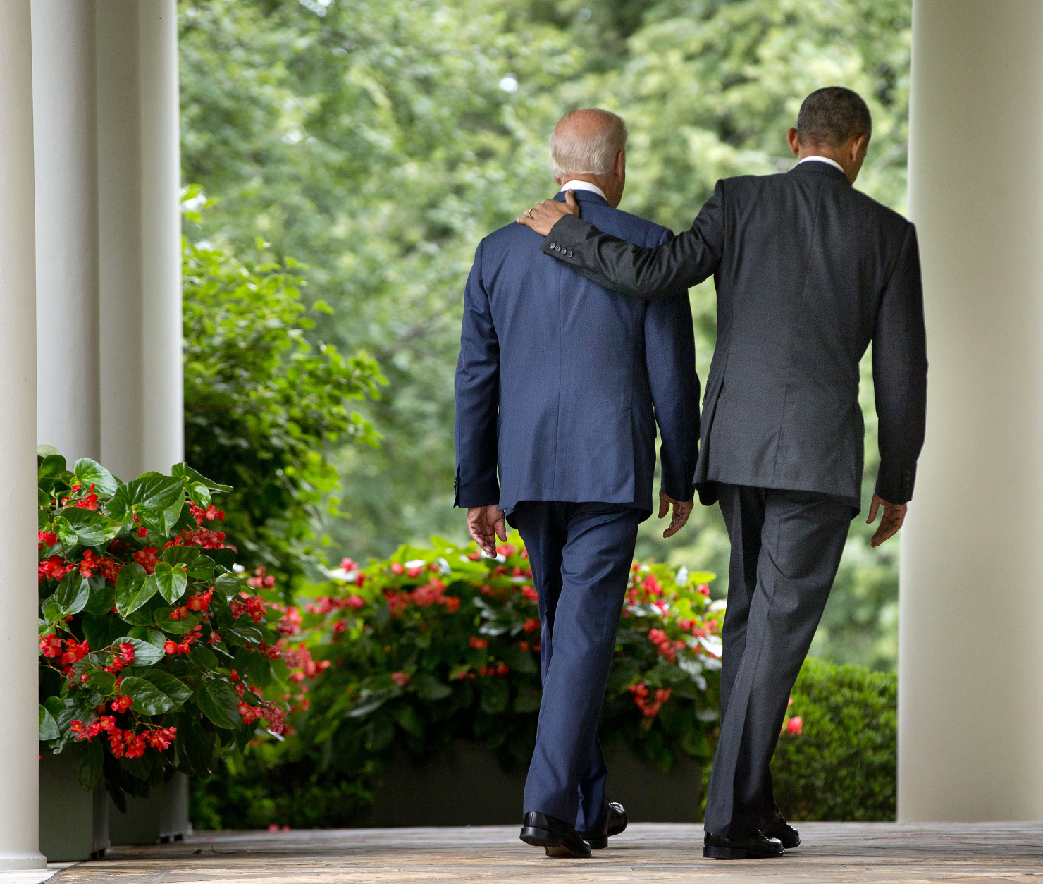 FOR USE AS DESIRED, YEAR END PHOTOS - FILE - President Barack Obama walks with Vice President Joe Biden back to the Oval Office of the White House in Washington, Thursday, June 25, 2015, after speaking in the Rose Garden after the Supreme Court upheld the subsidies for customers in states that do not operate their own exchanges under President Barack Obama's Affordable Care Act. (AP Photo/Pablo Martinez Monsivais, File)