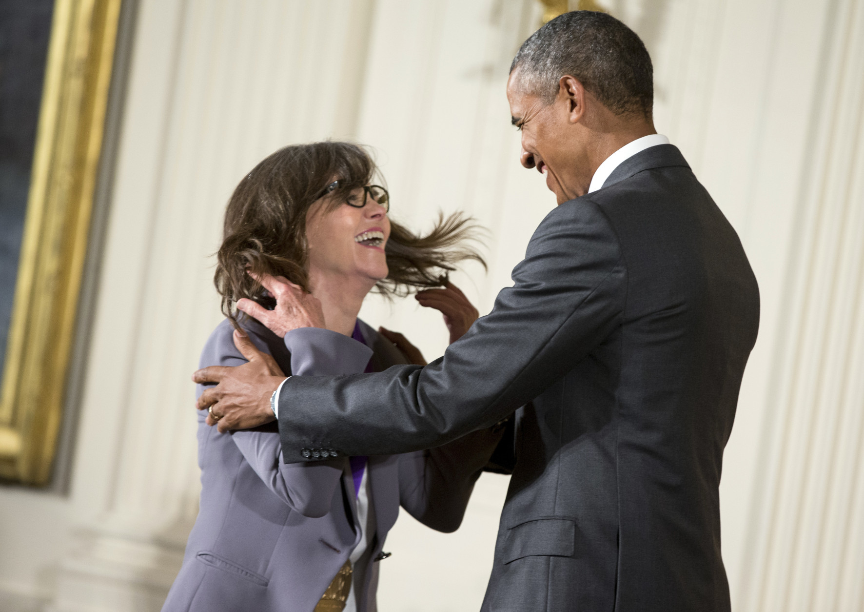 President Barack Obama awards the 2014 National Medal of Arts to actress and filmmaker Sally Field of Los Angles during a ceremony in the East Room at the White House in Washington, Thursday, Sept. 10, 2015. (AP Photo/Andrew Harnik)