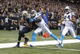 New Orleans Saints wide receiver Brandon Coleman (16) scores a touchdown against Carolina Panthers strong safety Roman Harper (41) and cornerback Josh Norman (24) and in the second half of an NFL football game in New Orleans, Sunday, Dec. 6, 2015. (AP Photo/Jonathan Bachman)