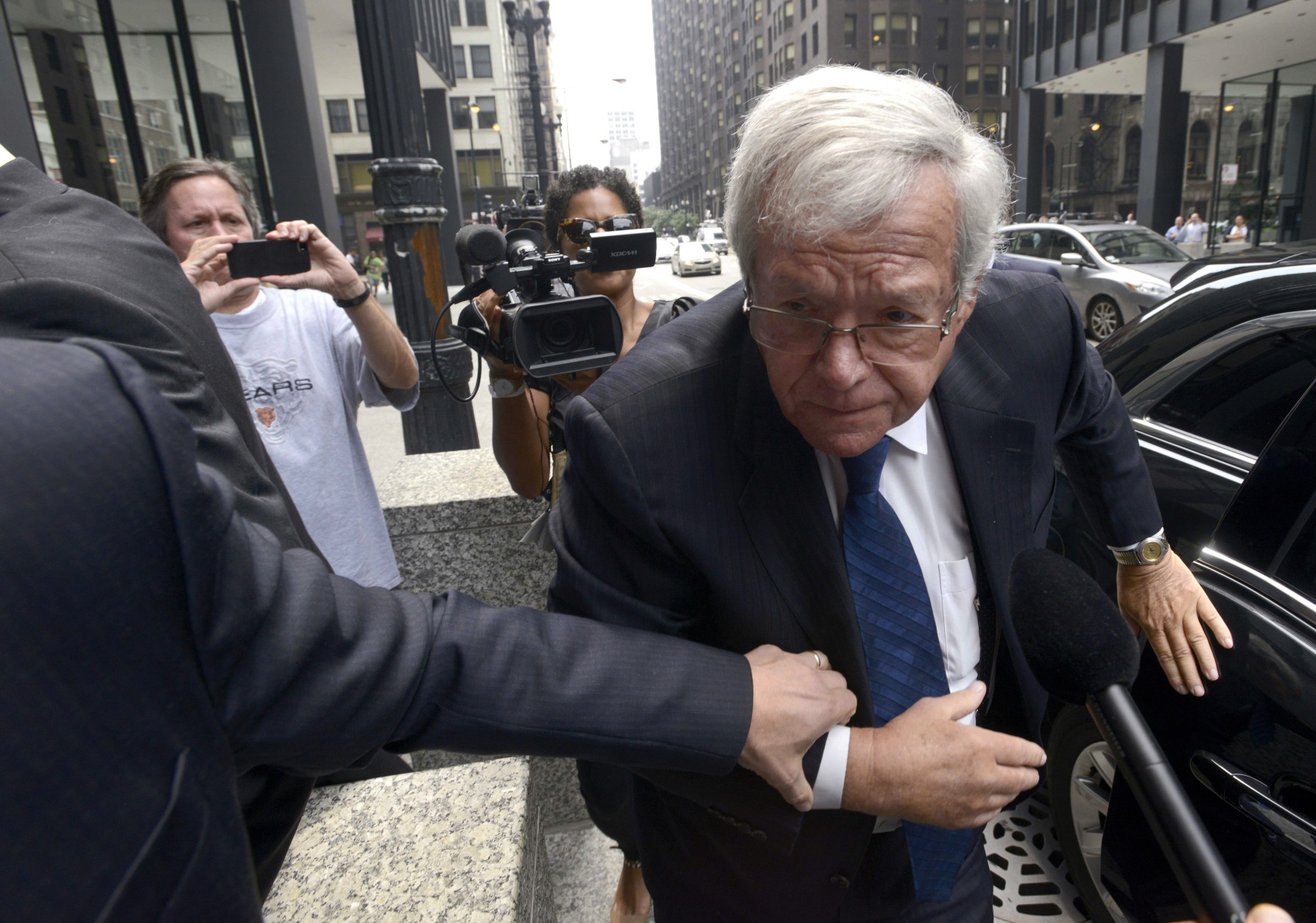 FOR USE AS DESIRED, YEAR END PHOTOS - FILE - Former House Speaker Dennis Hastert arrives at the federal courthouse, Tuesday, June 9, 2015, in Chicago for his arraignment on federal charges that he broke federal banking laws and lied about the money when questioned by the FBI. The indictment two weeks ago alleged Hastert agreed to pay $3.5 million to someone from his days as a high school teacher not to reveal a secret about past misconduct. (AP Photo/Paul Beaty, File)