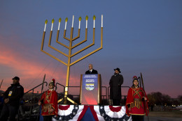 White House Chief of Staff Denis McDonough accompanied by Rabbi Levi Shemtov speaks during the annual National Menorah Lighting in celebration of Hanukkah, on the Ellipse near the White House in Washington, Sunday, Dec. 6, 2015. (AP Photo/Jose Luis Magana)