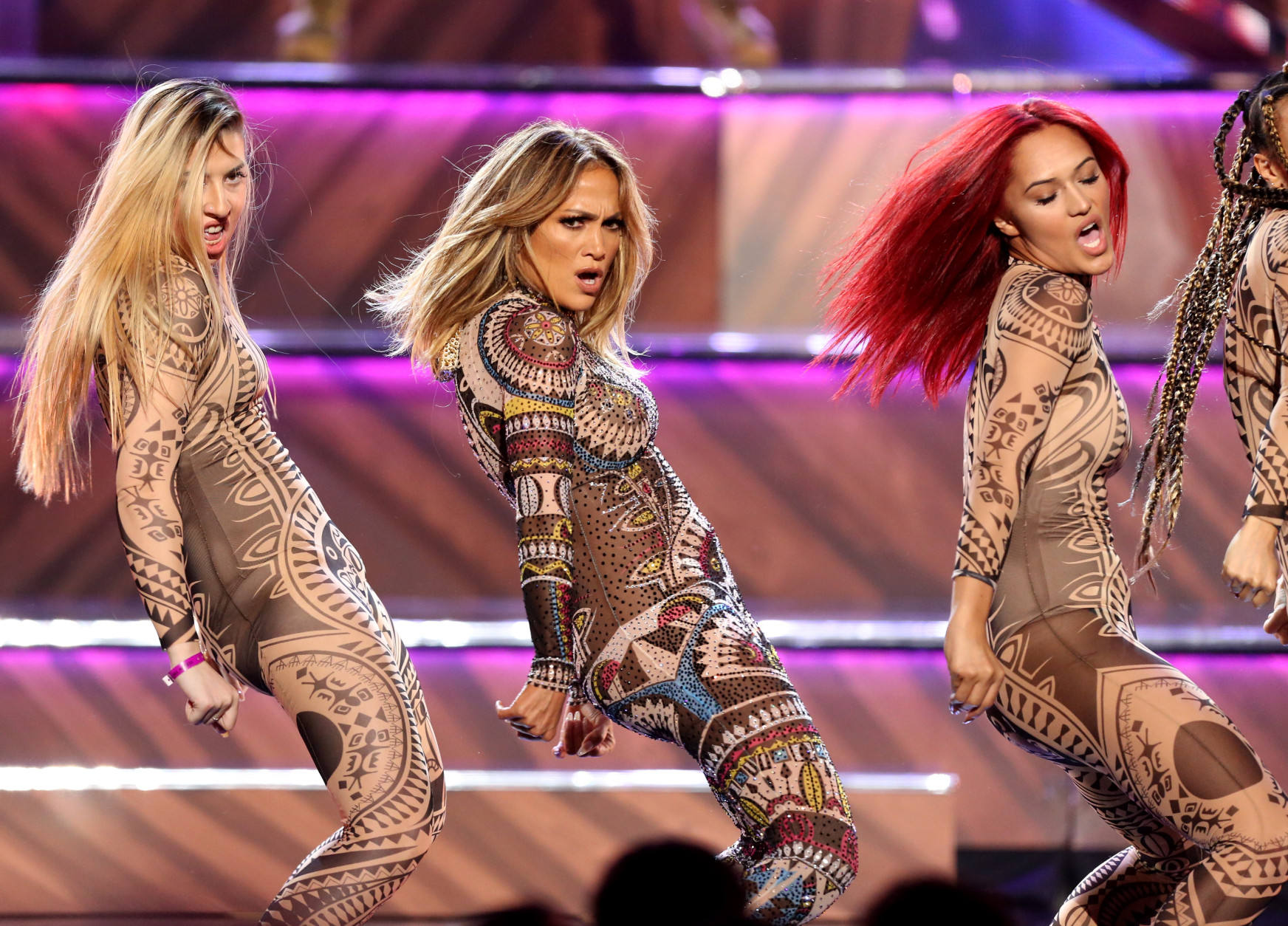 Jennifer Lopez, center, performs at the American Music Awards at the Microsoft Theater on Sunday, Nov. 22, 2015, in Los Angeles. (Photo by Matt Sayles/Invision/AP)