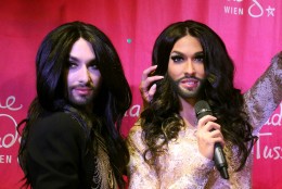Conchita Wurst, Austrian winner of the Eurovision Song Contest 2014, left, unveils his wax figure at Madame Tussauds in Vienna, Austria, Tuesday, May 12, 2015.  (AP Photo/Ronald Zak)