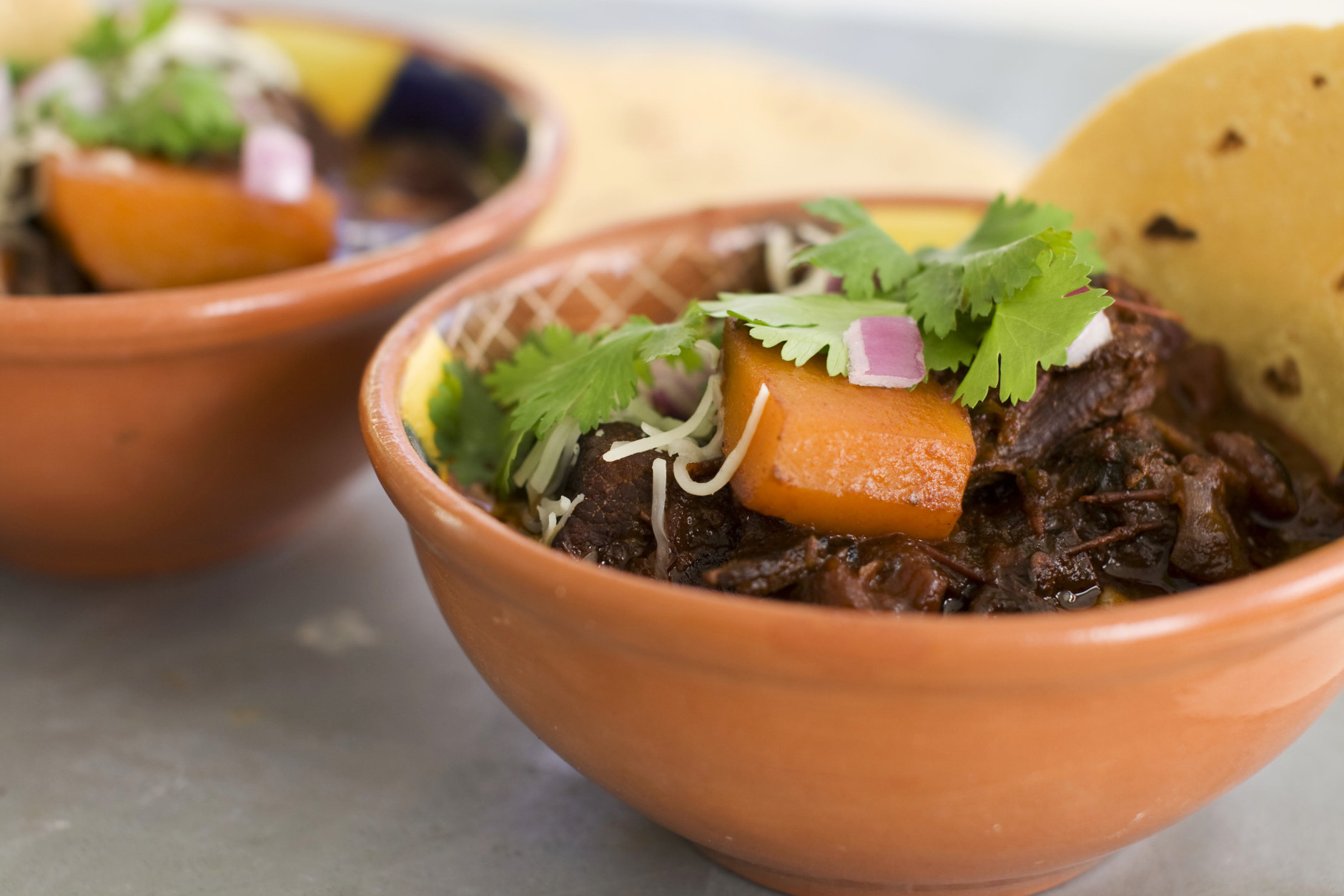 In this image taken on January 7, 2013, Mexican beef brisket and winter squash chili is shown served in bowls in Concord, N.H. (AP Photo/Matthew Mead)