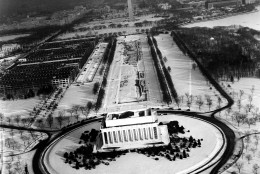 This aerial view of Washington, D.C., shows the Lincoln Memorial, center, with the Mall leading to the Washington Monument,  background, as snow covers the ground on Dec. 31, 1935.  (AP Photo)