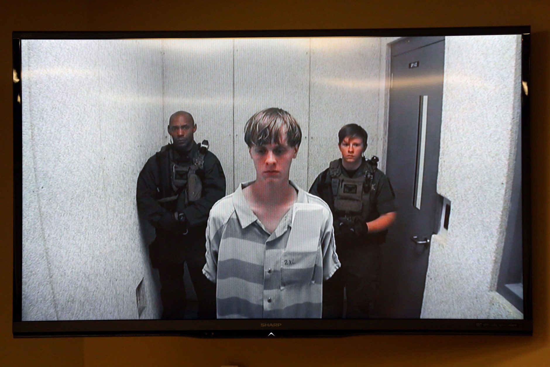 FOR USE AS DESIRED, YEAR END PHOTOS - FILE - Dylann Roof appears at a bond hearing court in North Charleston, S.C., June 19, 2015. Roof is accused of killing nine people inside Emanuel African Methodist Episcopal Church in Charleston on June 17. (Grace Beahm/The Post And Courier via AP, POOL, File)