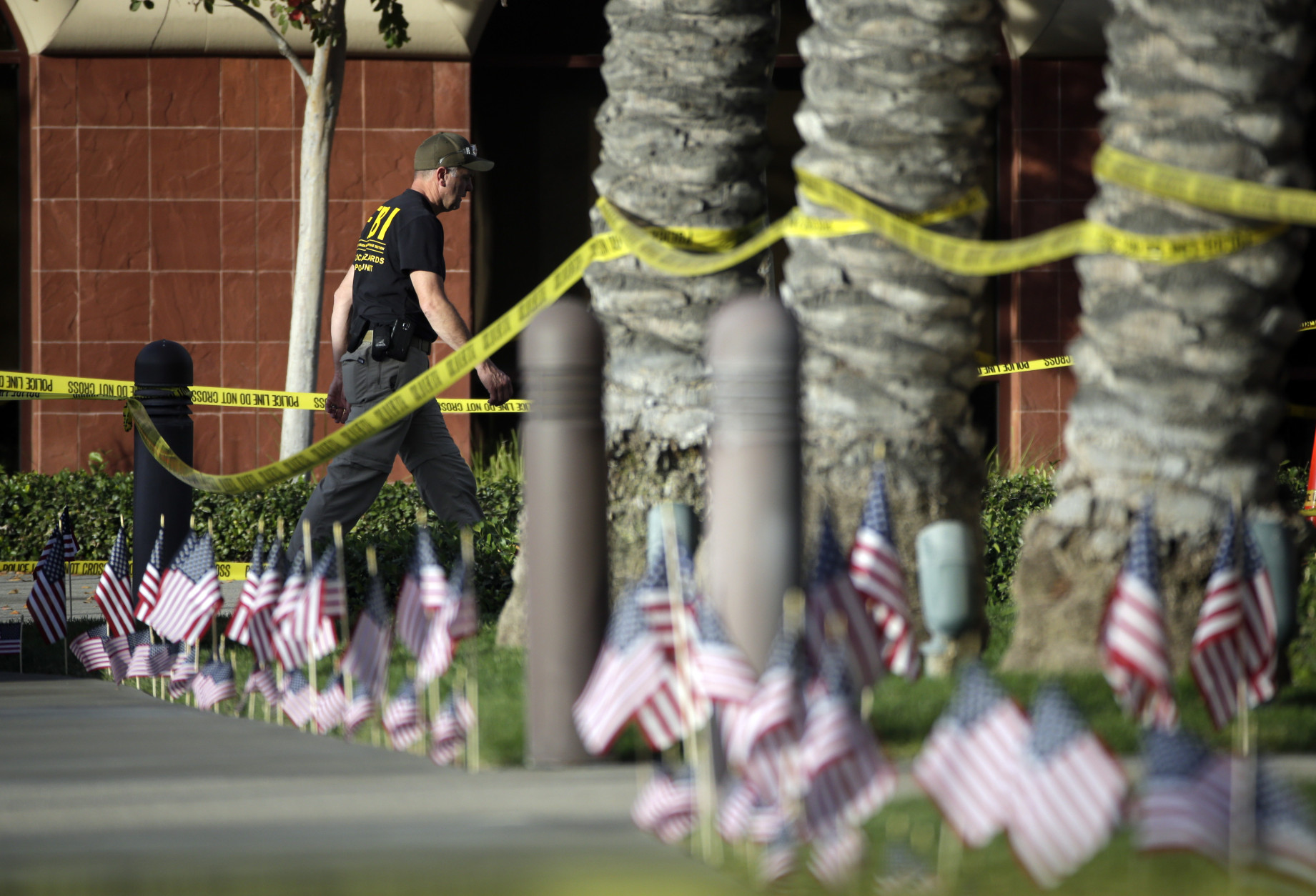 An investigator works the site of a mass shooting at the Inland Regional Center on Monday, Dec. 7, 2015 in San Bernardino, Calif. The FBI said it's investigating the massacre on Wednesday in San Bernardino, Calif., that killed dozens as a terrorist attack. (AP Photo/Jae C. Hong)