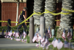 An investigator works the site of a mass shooting at the Inland Regional Center on Monday, Dec. 7, 2015 in San Bernardino, Calif. The FBI said it's investigating the massacre on Wednesday in San Bernardino, Calif., that killed dozens as a terrorist attack. (AP Photo/Jae C. Hong)