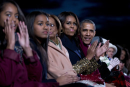 From right, President Barack Obama, first lady Michelle Obama, Michelle's mother Marian Robinson, daughters Sasha, and Malia, sit together during the National Christmas Tree Lighting ceremony at the Ellipse in Washington, Thursday, Dec. 3, 2015. (AP Photo/Carolyn Kaster)