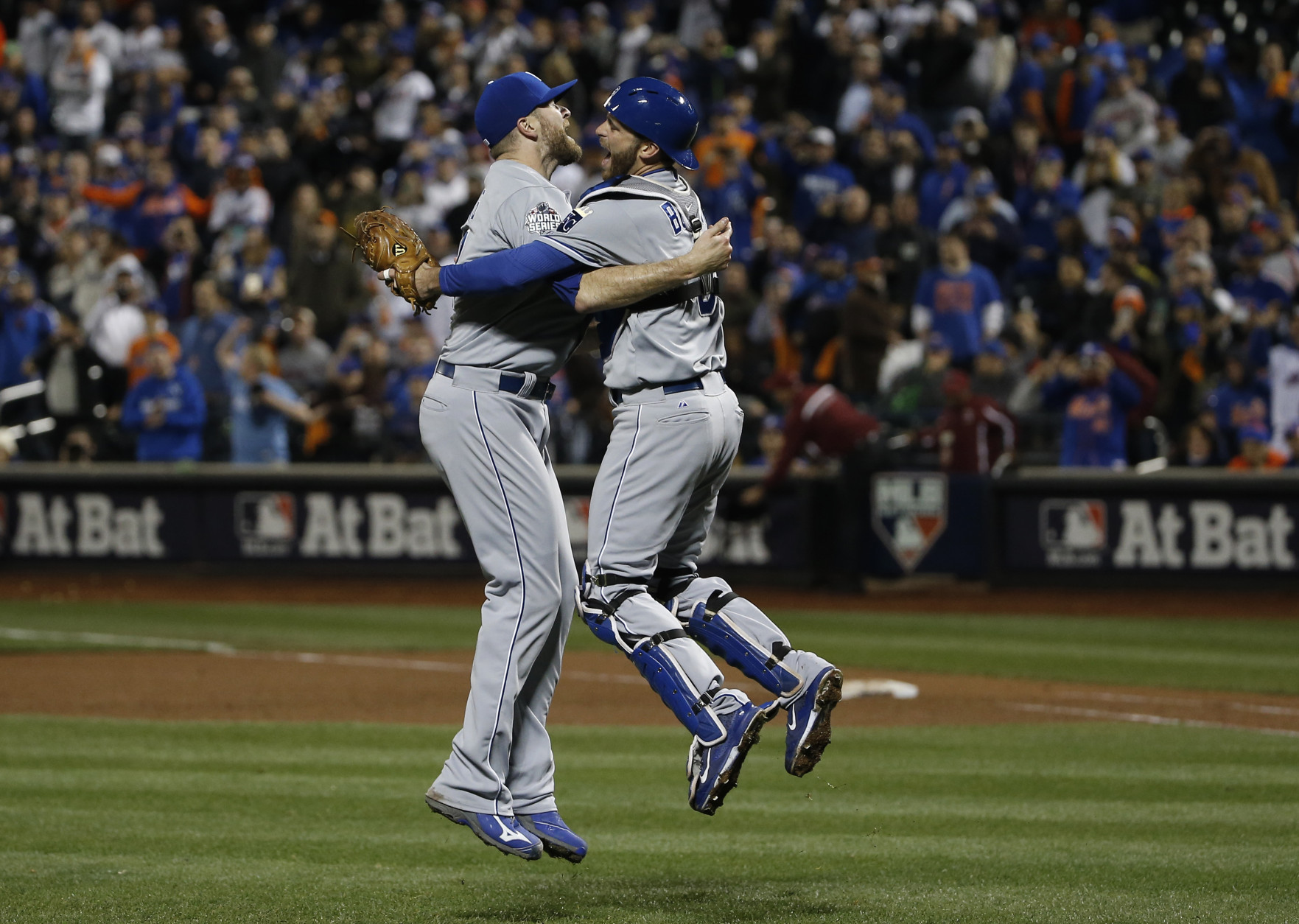 FOR USE AS DESIRED, YEAR END PHOTOS - FILE - Kansas City Royals pitcher Wade Davis (17) celebrates with Drew Buteraafter Game 5 of the Major League Baseball World Series against the New York Mets Monday, Nov. 2, 2015, in New York. The Royals won 7-2 to win the series. (AP Photo/Matt Slocum, File)