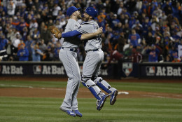 FOR USE AS DESIRED, YEAR END PHOTOS - FILE - Kansas City Royals pitcher Wade Davis (17) celebrates with Drew Buteraafter Game 5 of the Major League Baseball World Series against the New York Mets Monday, Nov. 2, 2015, in New York. The Royals won 7-2 to win the series. (AP Photo/Matt Slocum, File)