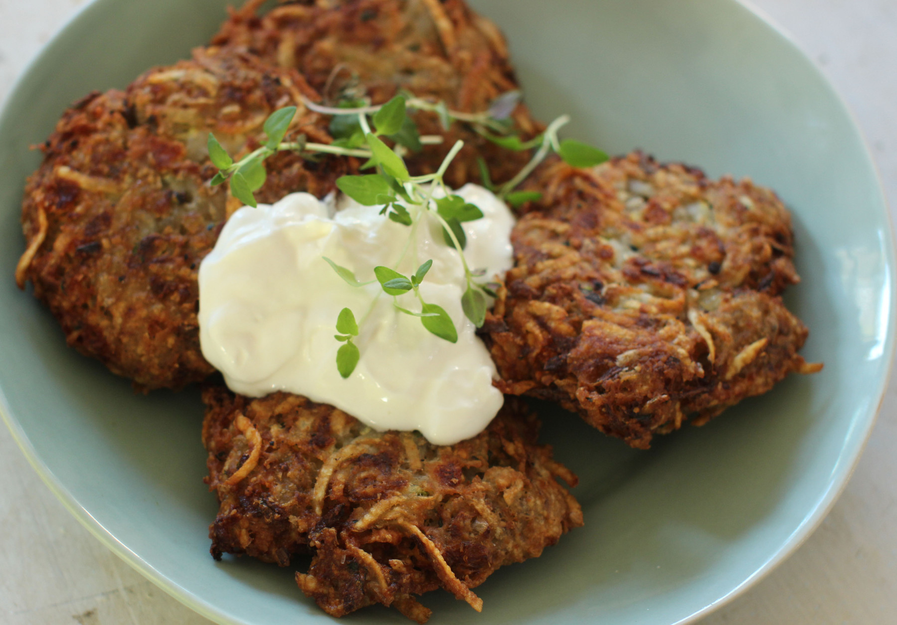 This Oct. 19, 2015 photo shows zesty zucchini and feta latkes in Concord, N.H. This dish is from a recipe by Alison Ladman. (AP Photo/Matthew Mead)