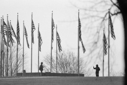 Associated Press reporter Steve Komarow, left, talks to anti-nuclear weapons activist Norman Mayer near the base of the Washington Monument in Washington, D.C., Dec. 8, 1982. Mayer drove a white truck up to the monument and threatened to blow it up with 1,000 pounds of dynamite. Komarow was picked from a pool of reporters after Mayer requested to speak to a member of the news media. (AP Photo/Scott Stewart)