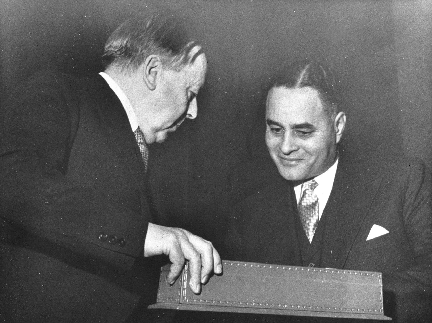 Dr. Ralph J. Bunche, right, is awarded the Nobel Peace Prize diploma, in box, from Gunnar Jahn, chairman of the Nobel Prize Committee, at Oslo University, Norway on Dec. 10, 1950.  Dr. Bunche, the only African-American to be awarded the Nobel Peace Prize, is recognized for his role as United Nations mediator in the peace settlement between Palestinian-Arabs and Jews in 1949.  (AP Photo)