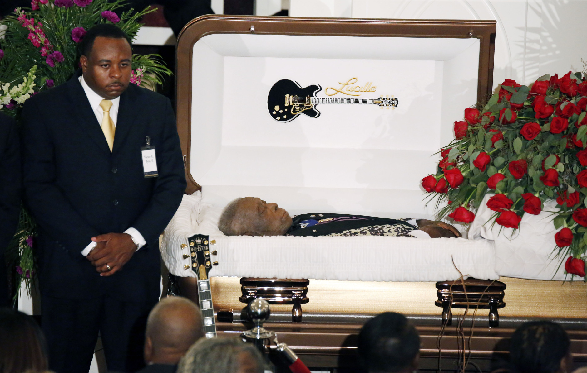 FOR USE AS DESIRED, YEAR END PHOTOS - FILE - A funeral home attendant stands watch over the casket bearing blues legend B.B. King prior to his funeral mass at Bell Grove Missionary Baptist Church in Indianola, Miss., Saturday, May 30, 2015. (AP Photo/Rogelio V. Solis, Pool, File)