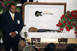 FOR USE AS DESIRED, YEAR END PHOTOS - FILE - A funeral home attendant stands watch over the casket bearing blues legend B.B. King prior to his funeral mass at Bell Grove Missionary Baptist Church in Indianola, Miss., Saturday, May 30, 2015. (AP Photo/Rogelio V. Solis, Pool, File)