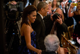 President Barack Obama and first lady Michelle Obama arrive at the 2015 Kennedy Center Honors reception in the East Room of the White House, Sunday, Dec. 6, 2015, in Washington. The 2015 Kennedy Center Honors Honorees are singer-songwriter Carole King, filmmaker George Lucas, actress and singer Rita Moreno, conductor Seiji Ozawa, and actress Cicely Tyson. (AP Photo/Andrew Harnik)