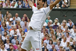 FOR USE AS DESIRED, YEAR END PHOTOS - FILE - Novak Djokovic of Serbia celebrates winning the men's singles final against Roger Federer of Switzerland at the All England Lawn Tennis Championships in Wimbledon, London, Sunday July 12, 2015. Djokovic won the match 7-6, 6-7, 6-4, 6-3. (AP Photo/Alastair Grant, File)