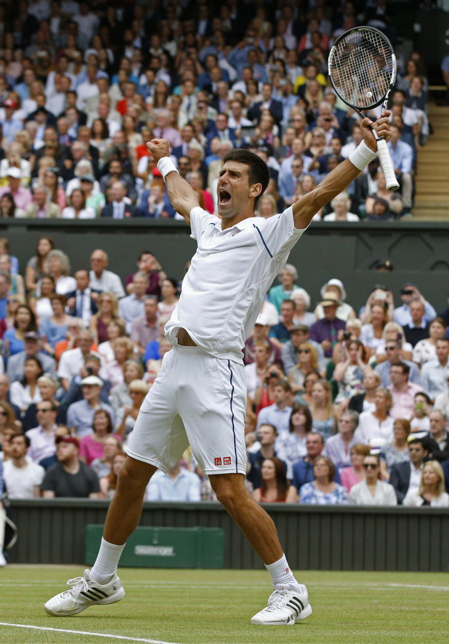 FOR USE AS DESIRED, YEAR END PHOTOS - FILE - Novak Djokovic of Serbia celebrates winning the men's singles final against Roger Federer of Switzerland at the All England Lawn Tennis Championships in Wimbledon, London, Sunday July 12, 2015. Djokovic won the match 7-6, 6-7, 6-4, 6-3. (AP Photo/Alastair Grant, File)