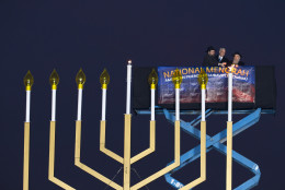 From left, Rabbi Levi Shemtov, White House Chief of Staff Denis McDonough and Rabbi Abraham Shemtov participate in the annual National Menorah Lighting in celebration of Hanukkah, on the Ellipse near the White House in Washington, Sunday, Dec. 6, 2015. (AP Photo/Jose Luis Magana)
