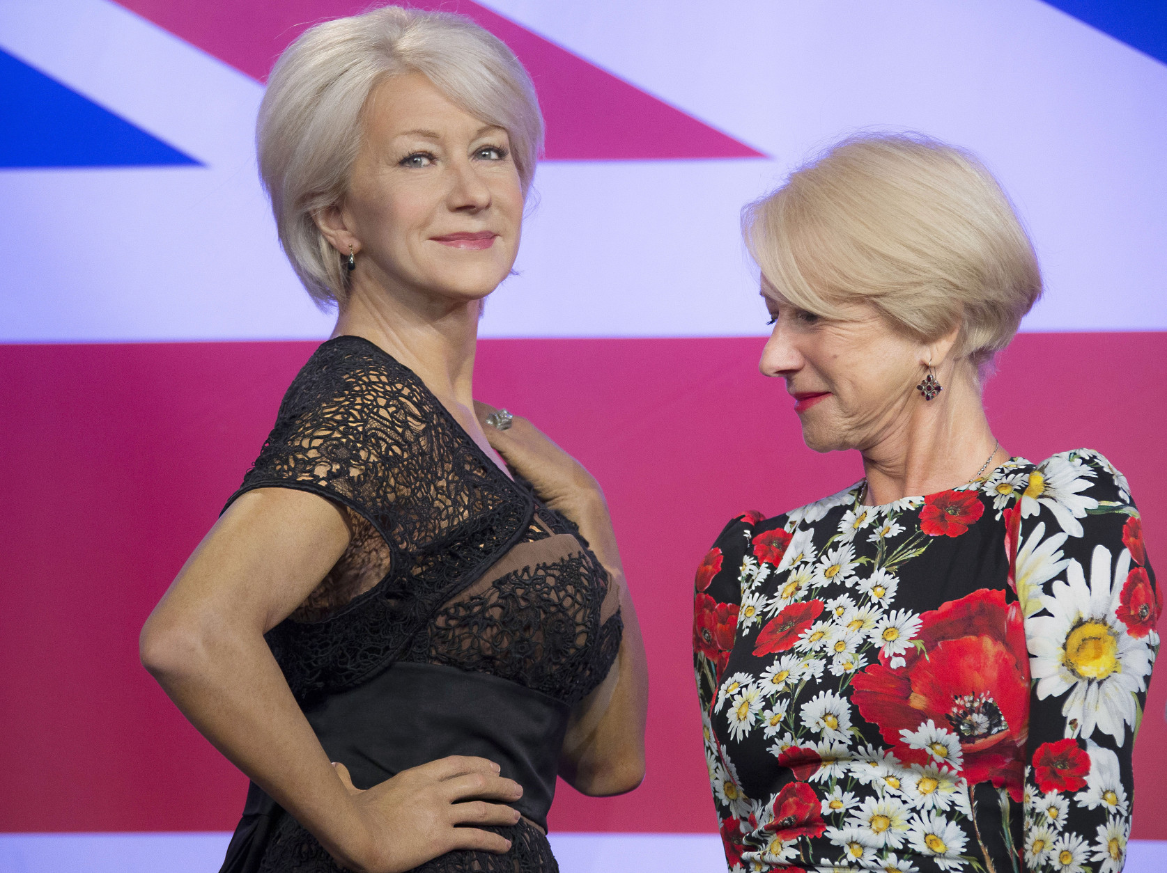 British actress Helen Mirren looks at one of three wax figures of herself, made in celebration of her recent 70th birthday, at Madame Tussauds in central London, Thursday, July 30, 2015. (Photo by Joel Ryan/Invision/AP)