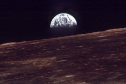 The Earth shines over the horizon of the Moon in this Dec. 24, 1968 photo shot by the astronauts on Apollo 8.  Apollo 8 was launched from Cape Canaveral on Dec. 21, 1968.  (AP Photo)