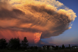 FOR USE AS DESIRED, YEAR END PHOTOS - FILE - The Calbuco volcano erupts near Puerto Varas, Chile, Wednesday, April 22, 2015. The volcano erupted for the first time in more than 42 years, billowing a huge ash cloud over a sparsely populated, mountainous area in southern Chile. (AP Photo/Diego Main/Aton Chile, File) CHILE OUT - NO USAR EN CHILE