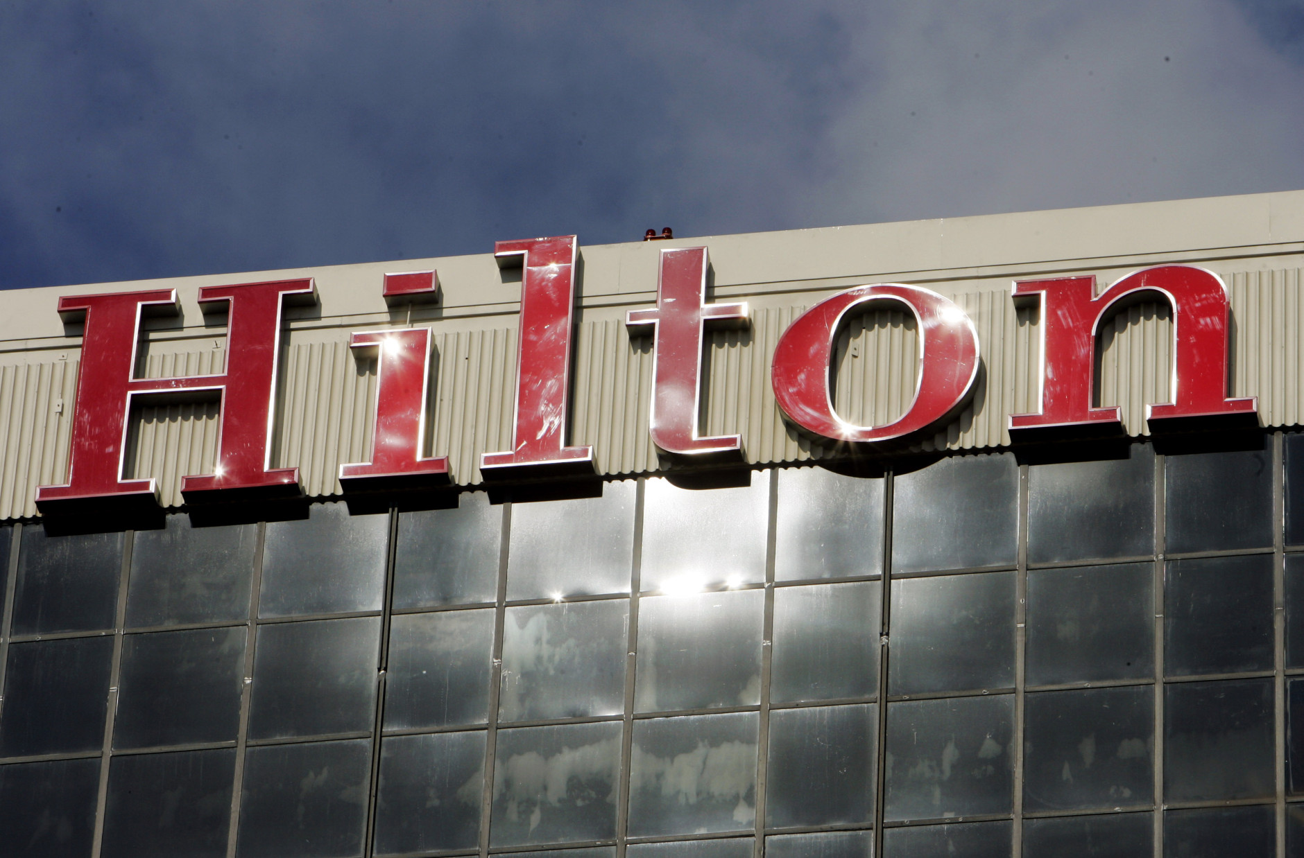 FILE - The sign atop the Hilton Los Angeles Airport hotel is seen in this Wednesday, Jan. 31, 2007 file photo. The McLean, Va. company, founded in 1919, was taken private by investment firm The Blackstone Group in October 2007. (AP Photo/Reed Saxon, File)