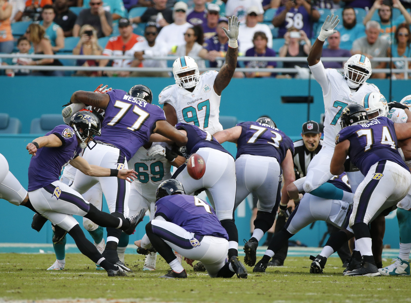 Baltimore Ravens kicker Justin Tucker (9) scores a field goal during the first half of an NFL football game against the Miami Dolphins, Sunday, Dec. 6, 2015, in Miami Gardens, Fla.  (AP Photo/Wilfredo Lee)