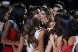 Other contestants comfort Miss Colombia Ariadna Gutierrez, center, after she was incorrectly crowned Miss Universe at the Miss Universe pageant on Sunday, Dec. 20, 2015, in Las Vegas. Miss Philippines Pia Alonzo Wurtzbach was named Miss Universe. (AP Photo/John Locher)