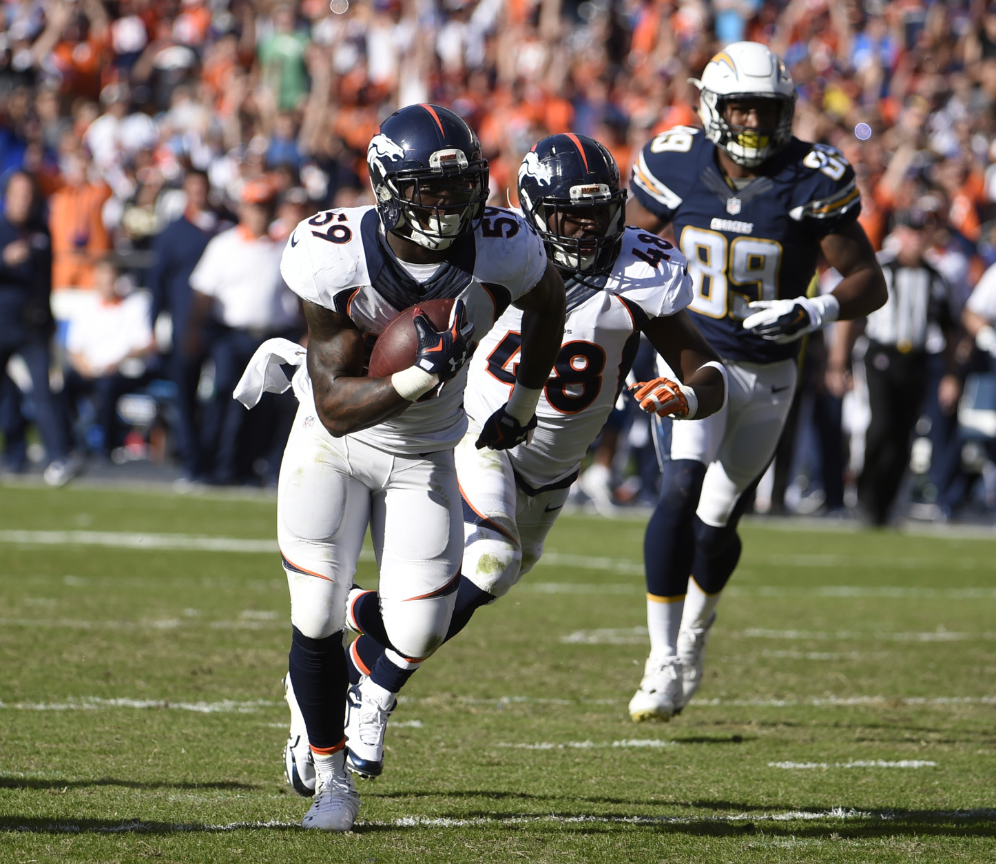 Denver Broncos inside linebacker Danny Trevathan scores on a interception against the San Diego Chargers during the first half in an NFL football game Sunday, Dec. 6, 2015, in San Diego. (AP Photo/Denis Poroy)