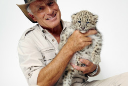 Wildlife advocate Jack Hanna poses for a portrait with a snow leopard cub on Monday, Oct. 12, 2015 in New York. (Photo by Dan Hallman/Invision/AP)