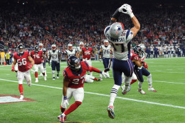 New England Patriots tight end Rob Gronkowski (87) catches a pass for a touchdown over Houston Texans strong safety Quintin Demps (27) during the first hall of an NFL football game Sunday,  Dec. 13, 2015, in Houston. (AP Photo/George Bridges)