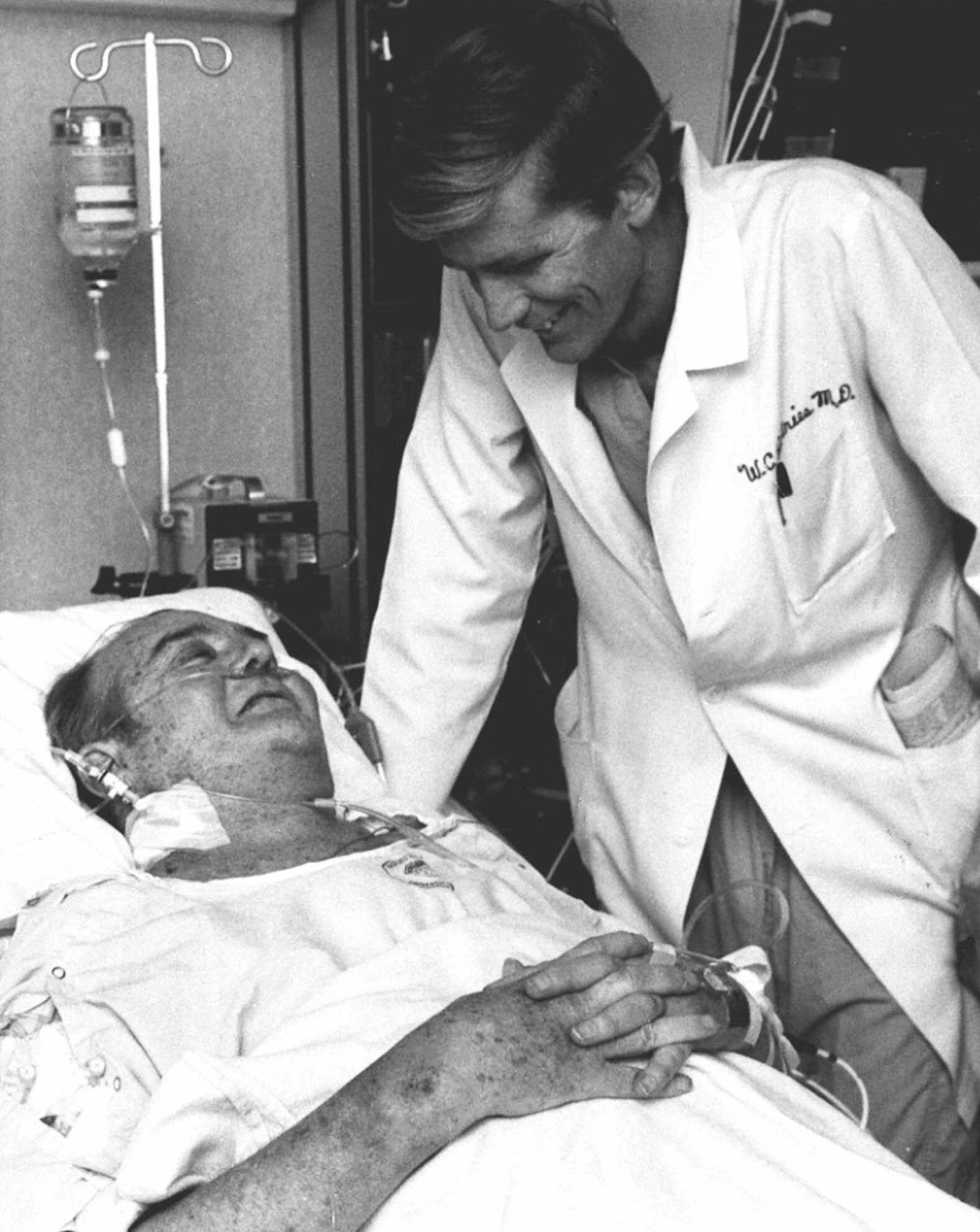 Artificial heart recipiant Barney B. Clark, left, smiles at his surgeon, Dr. William DeVries, in Salt Lake City, in this Dec. 3, 1982 photo. Clark, who lived 112 days with the Jarvik-7 heart after the landmark surgery, had little expectation of longtime survival. "He had faced his mortality," said his widow UnaLoy Clark-Ferrar. "He knew he was going to die. He knew he had to be in that position (for doctors) to consider him. He saw it as a real opportunity for him to contribute something to medical science. That was the reason he did it." (AP Photo)