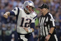 FOR USE AS DESIRED, YEAR END PHOTOS - FILE - New England Patriots quarterback Tom Brady (12) celebrates a touchdown against the Seattle Seahawks during the first half of NFL Super Bowl XLIX football game Sunday, Feb. 1, 2015, in Glendale, Ariz. (AP Photo/Patrick Semansky, File)