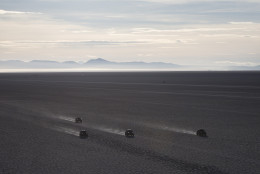 Competitors race across the Uyuni salt flats during the eighth stage of the Dakar Rally 2015 between Uyuni, Bolivia, and Iquique, Chile, Sunday, Jan. 11, 2015. The race will finish on Jan. 17 in Argentina where it started. (AP Photo/Felipe Dana)