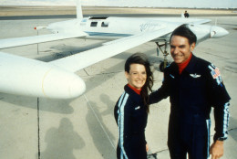 Co-pilots Dick Rutan and Jeana Yeager, left, (no relationship to test pilot Chuck Yeager), will attempt to circumnavigate the globe without refuelling in an experimental aircraft called Voyager. Photo was taken after a test flight over the Mojave Desert December 19, 1985. The aircraft is made of plastic and graphite fiber composite and able to carry five-times its own weight in fuel, was designed by Rutan's brother, Burt, and is so economical that it can complete the 25 000 mile (40 250 km) flight along the equator in about 12 days with fuel to spare. (AP Photo/Doug Pizac)
