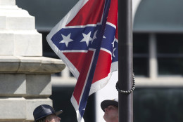 FOR USE AS DESIRED, YEAR END PHOTOS - FILE - An honor guard from the South Carolina Highway patrol removes the Confederate battle flag from the Capitol grounds in Columbia, S.C., ending its 54-year presence there, on Friday, July 10, 2015. (AP Photo/John Bazemore, File)