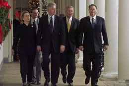 President Bill Clinton holds hands with First Lady Hillary Rodham Clinton while on the way to a rally with House Democrats following a historic vote in the House of Representatives to impeach the President. Walking with the first couple is White House Chief of Staff John Podesta, House Minority Leader Richard Gephardt and Vice President Al Gore. (AP Photo/Greg Gibson)