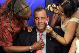 FOR USE AS DESIRED, YEAR END PHOTOS - FILE - Republican presidential candidate New Jersey Gov. Chris Christie gets his microphone and make-up prepared for his appearance on "The Five" television program, on the Fox News Channel, in New York, Wednesday, July 22, 2015. (AP Photo/Richard Drew, File)