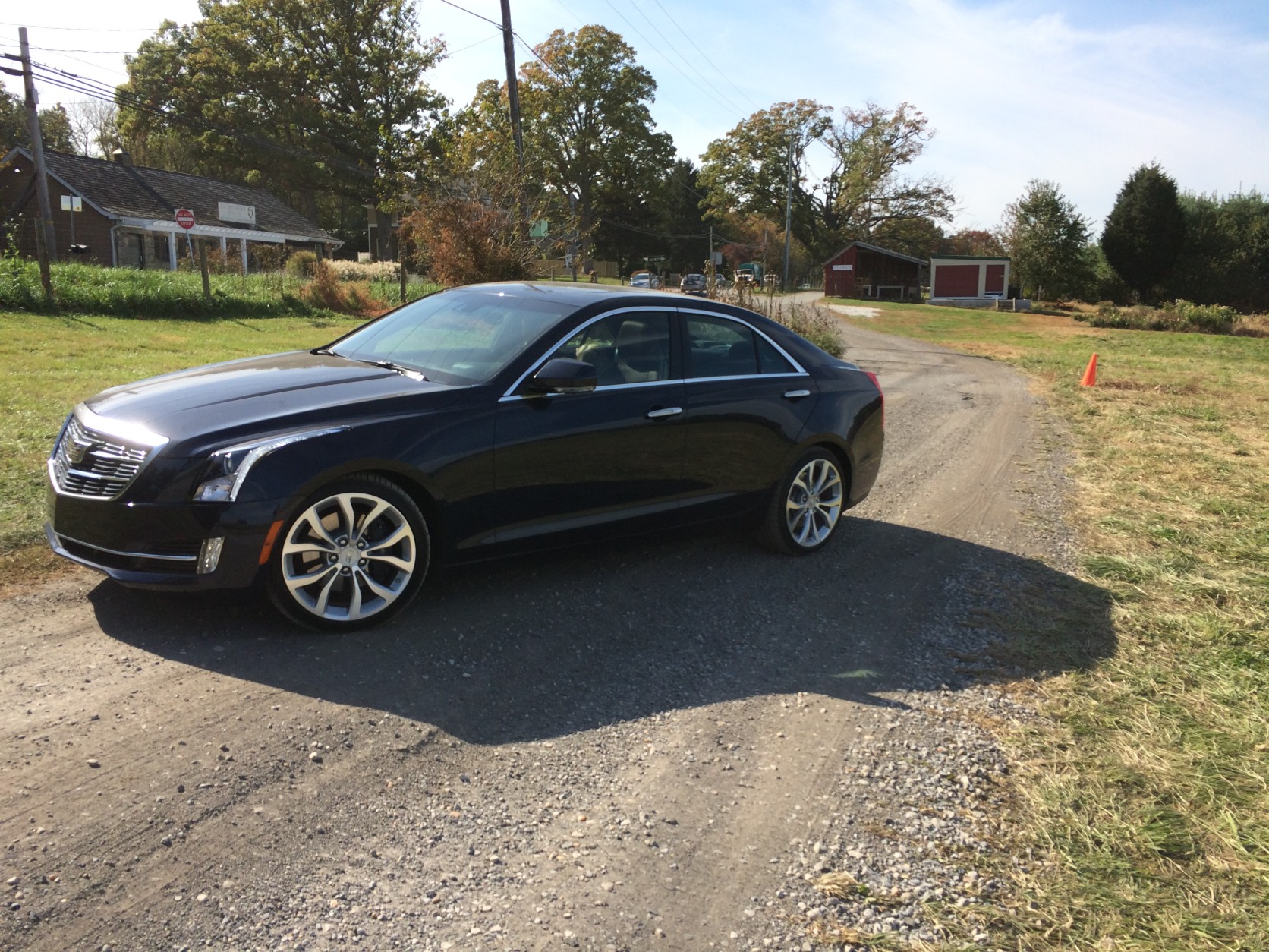 The Cadillac ATS still has modern standout looks with sharp angles and cool looking headlights that stretch from the bumper up to the hood. (WTOP/Mike Parris)